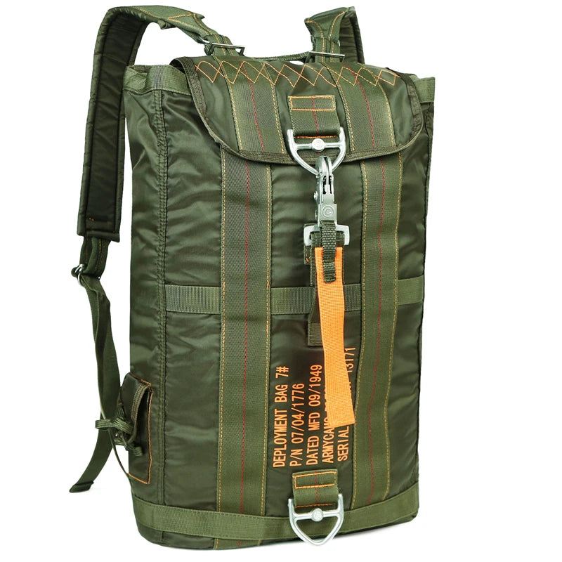 Load image into Gallery viewer, Green backpack with orange tag on a white background
