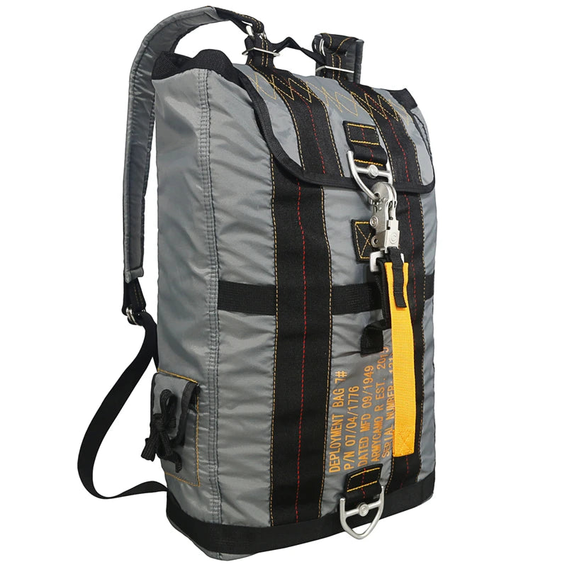 Load image into Gallery viewer, Gray backpack with black straps and yellow accents on a white background
