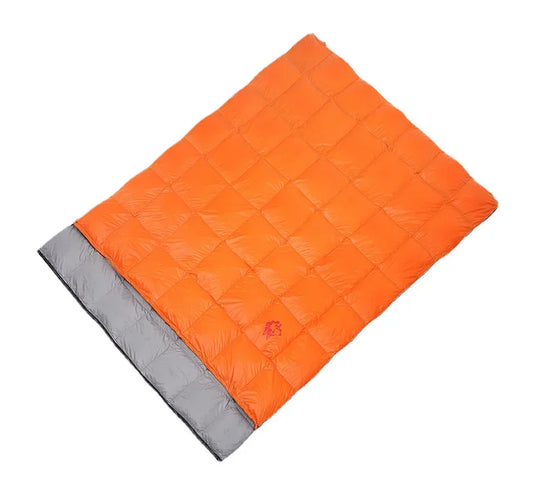 Orange quilt with gray border on a white background