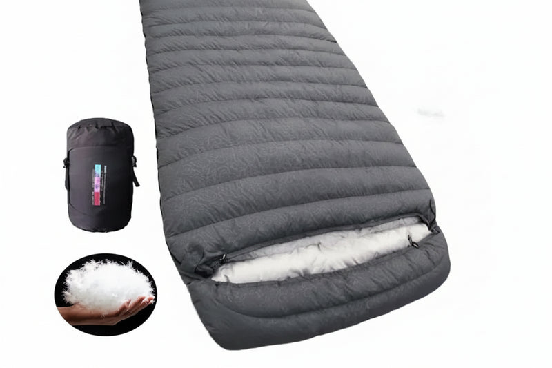 Load image into Gallery viewer, Dark grey sleeping bag with 3000g duck down filling, including a black carrying bag and close-up of down filling.

