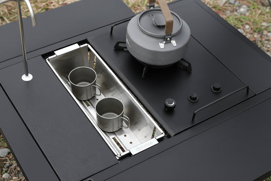 Dotwise IGT Drainer & Storage Box on a camping stove with cups inside