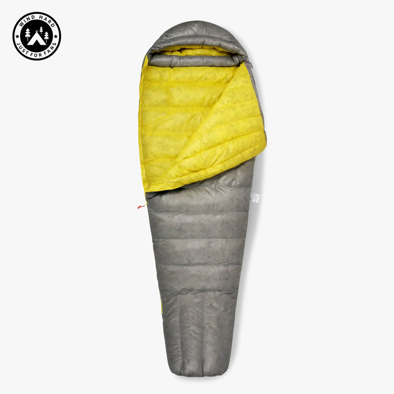 Load image into Gallery viewer, Gray and yellow sleeping bag with a visible brand logo on a white background
