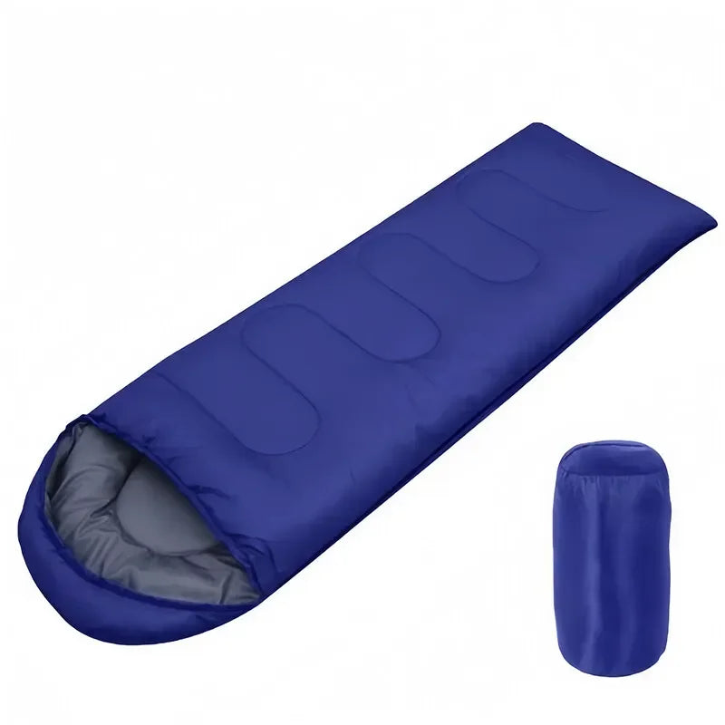 Load image into Gallery viewer, Blue sleeping bag with a smaller blue bag on a white background
