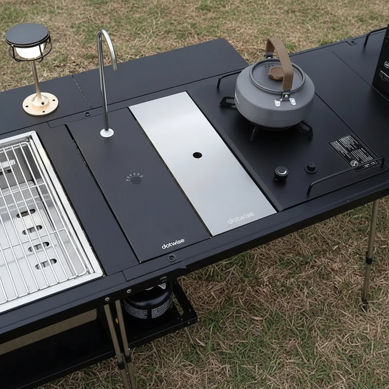 Load image into Gallery viewer, Tabletop camping stove with pot and accessories on a grassy background, featuring text about securing the cover and maximizing camp space.
