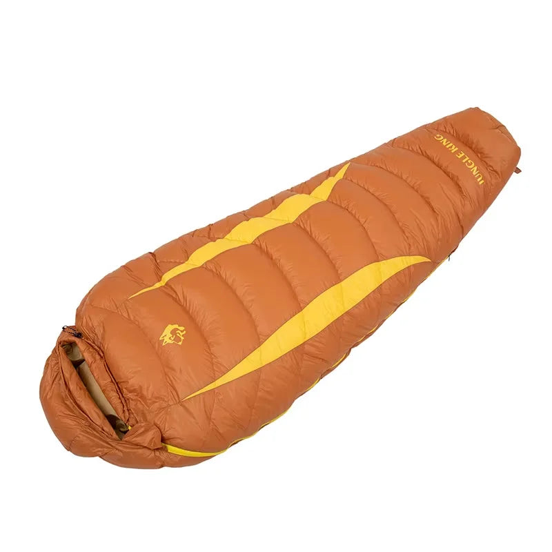 Load image into Gallery viewer, Orange sleeping bag with yellow accents on a white background
