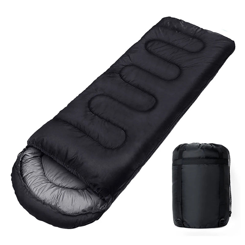 Load image into Gallery viewer, Black sleeping bag with its compressed version on a white background

