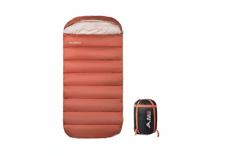 Load image into Gallery viewer, Orange sleeping bag with carrying bag and product details on a white background
