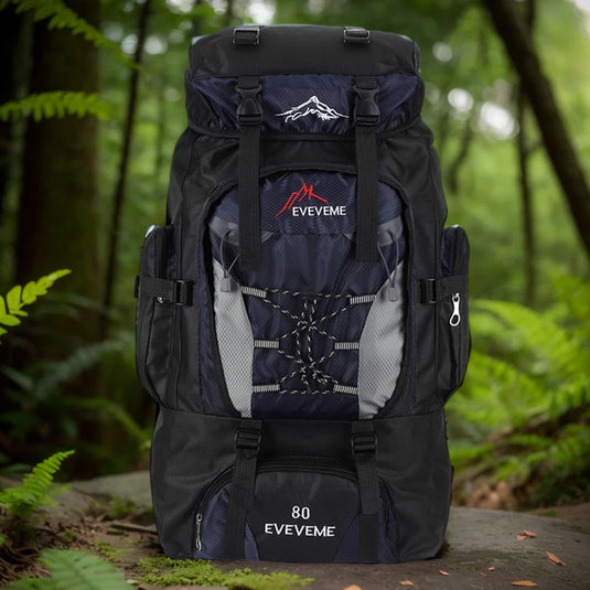 Black and blue hiking backpack with 'EVEVEME' branding in a forest setting