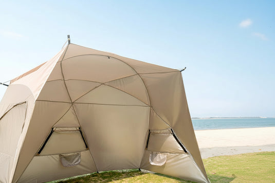 Large beach canopy tent for 4-8 people set up at the shoreline with aluminum pole frame