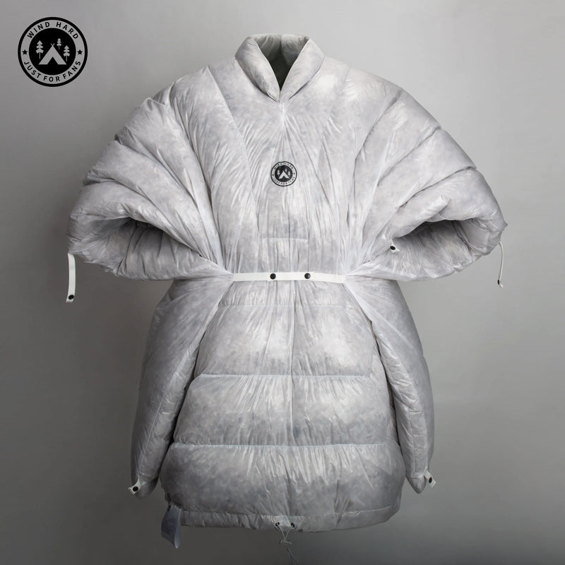 Load image into Gallery viewer, Gray puffer coat with a brand logo on a gray background
