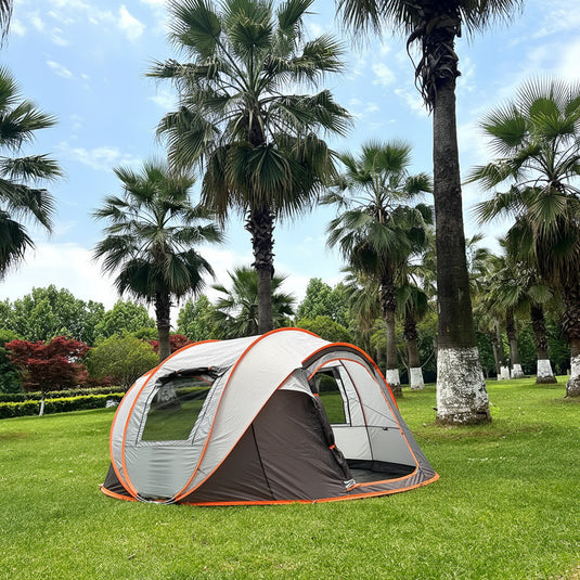 A tent in a park with palm trees