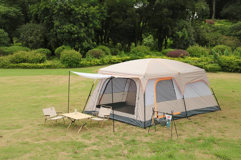 Load image into Gallery viewer, A large outdoor tent in a park setting with text describing the tent's features.
