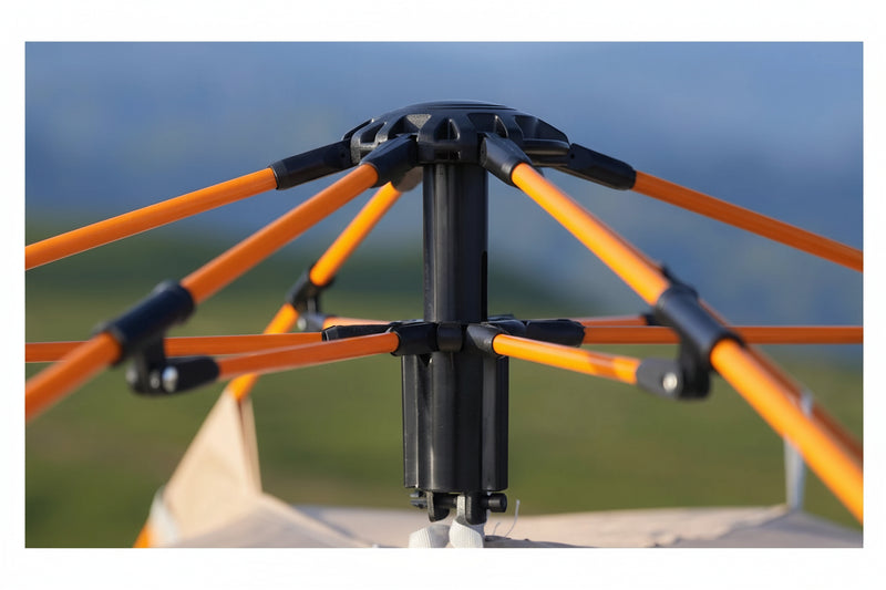 Load image into Gallery viewer, Close-up of a tent frame with orange poles and black connectors against a blurred natural background.
