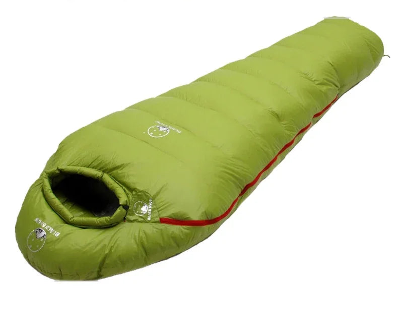 Load image into Gallery viewer, Green sleeping bag with red trim on a white background
