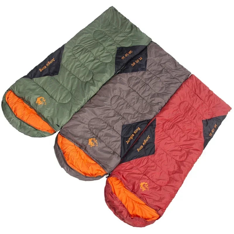 Load image into Gallery viewer, Three sleeping bags in green, gray, and red with orange interior on a white background.
