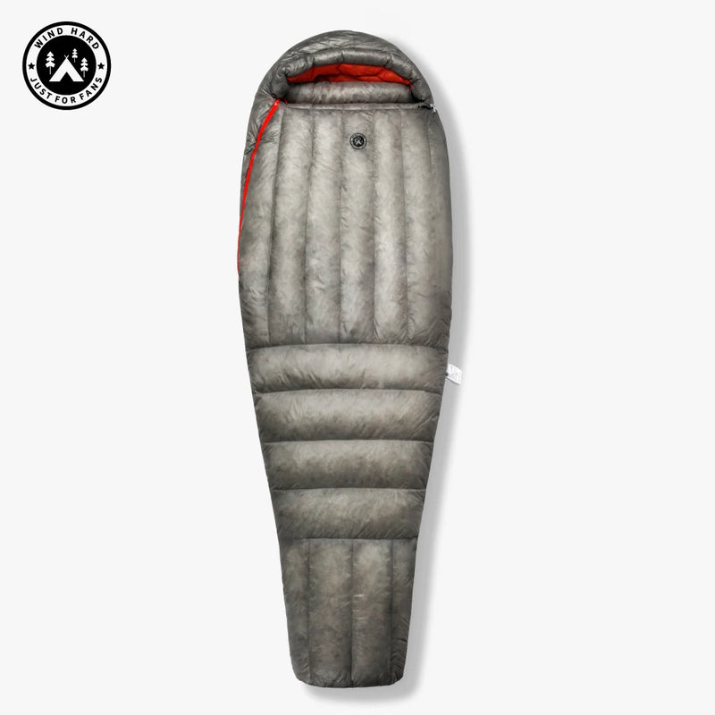 Load image into Gallery viewer, Gray sleeping bag with red interior on a white background, featuring a brand logo.
