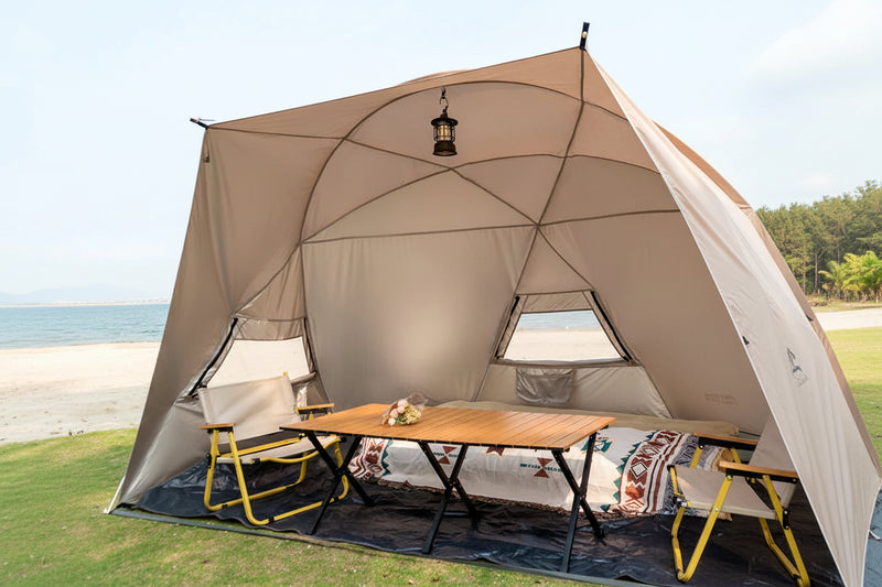 Load image into Gallery viewer, Large beach canopy tent for 4-8 people set up at the shoreline with aluminum pole frame
