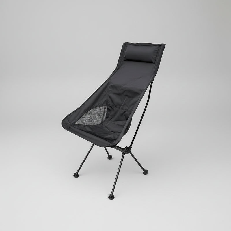 Load image into Gallery viewer, Black camping chair on a grassy area with trees and a hammock in the background
