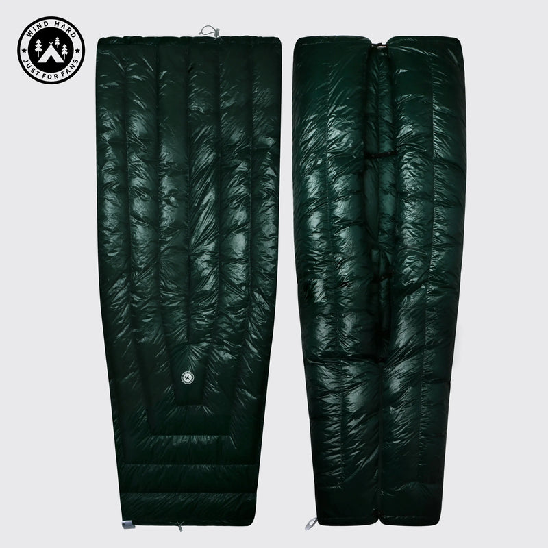 Load image into Gallery viewer, Dark green sleeping bag with quilted texture on a light gray background
