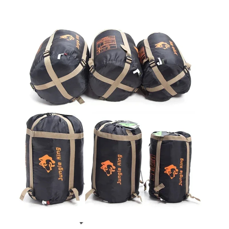 Load image into Gallery viewer, Set of black sleeping bags with orange logos on a white background

