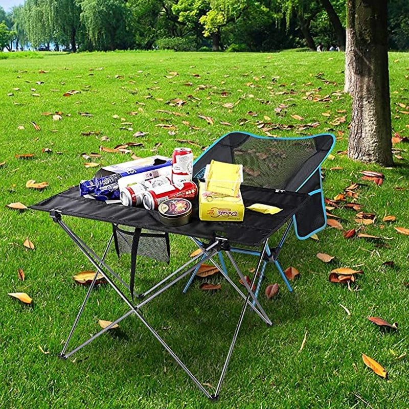 Load image into Gallery viewer, Portable folding camping table with supplies on a grassy outdoor area
