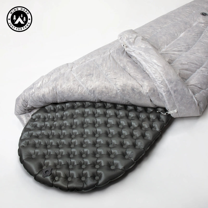Load image into Gallery viewer, Gray sleeping bag and black inflatable mattress on a white background with a brand logo.
