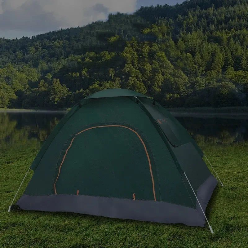 Load image into Gallery viewer, Green camping tent on grass with a forest in the background
