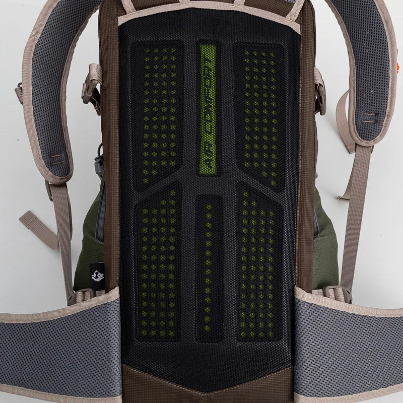 Load image into Gallery viewer, Close-up of a backpack with a textured back panel and straps.
