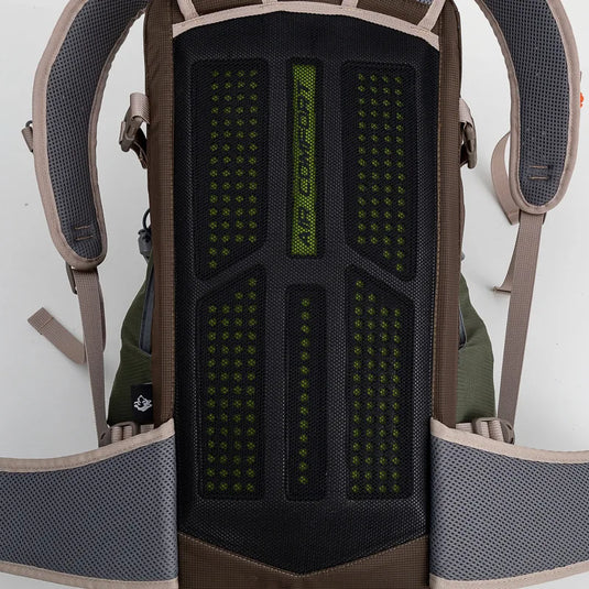 Close-up of a backpack with a textured back panel and straps.
