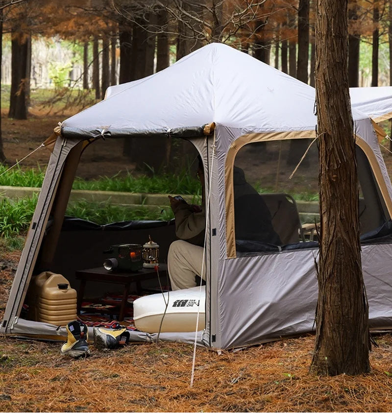 Load image into Gallery viewer, Camping tent with front and rear ventilation design in a forest setting
